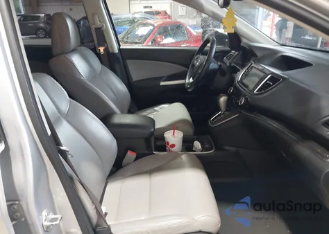 2015 Honda Cr-V Touring z USA, uszkodzony, nr VIN 5J6RM4H91FL120929